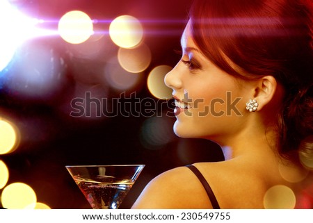 luxury, vip, nightlife, party concept - beautiful woman in evening dress with cocktail