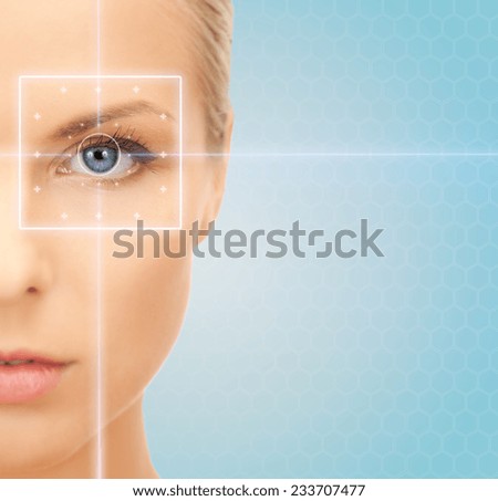 health, medicine, identity, vision and people concept - beautiful young woman with laser light lines on her eye over blue background