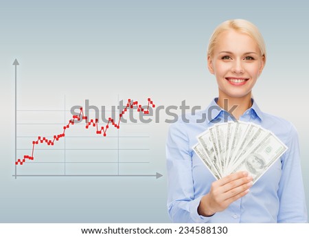 business, people and money concept - smiling businesswoman with dollar cash money over gray background and forex graph going up