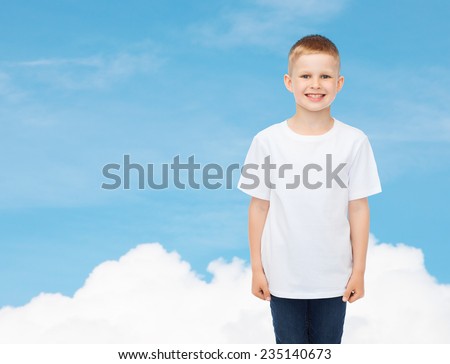 advertising, dream, people and childhood concept - smiling little boy in white blank t-shirt over sky background