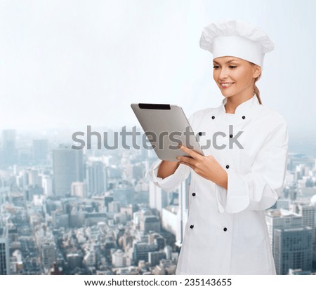 cooking, technology and people concept - smiling female chef, cook or baker with tablet pc computer over city background