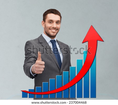 business, people, economics, success  and gesture concept - smiling young businessman showing thumbs up over gray background and growth chart