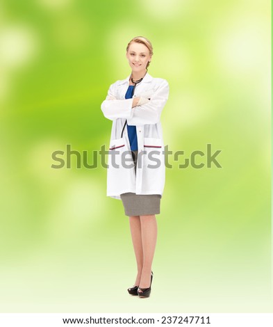 people, medicine and profession concept - smiling young female doctor over green background