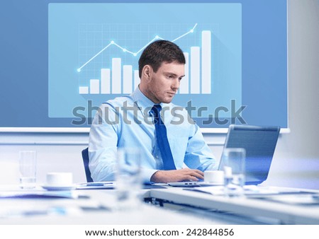 business, people and work concept - businessman with laptop computer and growth chart on virtual screen in office