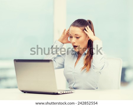 business, office and technology concept - stressed businesswoman with laptop at work