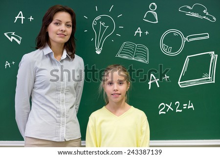 education, elementary school, learning and people concept - little school girl and teacher at green chalkboard with doodles in classroom