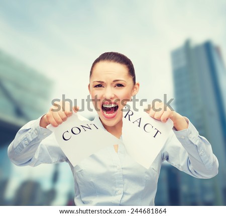 business, documents, people, legal and real estate concept - serious businesswoman tearing contract outdoors