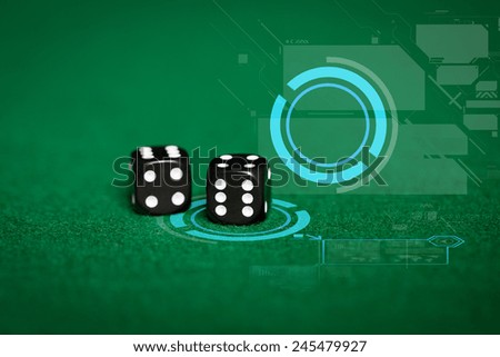 gambling, fortune, game, technology and entertainment concept - close up of black dice on green casino table and virtual projection