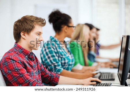 education concept - student with computer studying at school