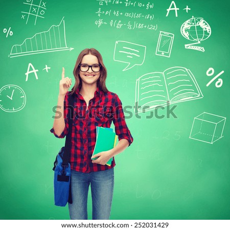 education, happiness and people concept - smiling student girl showing thumbs up over green board background