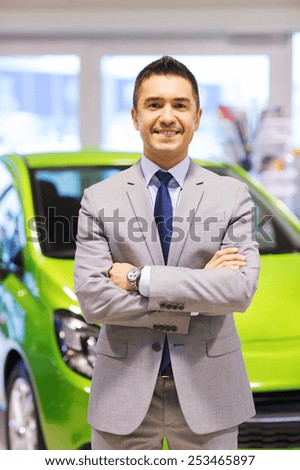 auto business, car sale, consumerism and people concept - happy man at auto show or salon