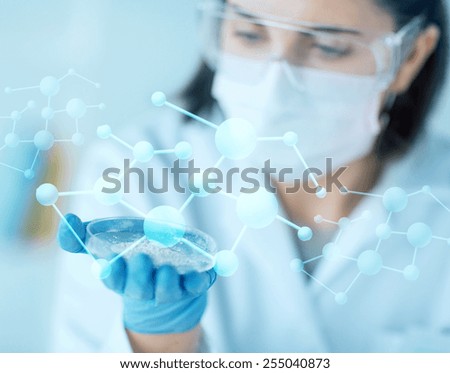 science, chemistry, biology, medicine and people concept - close up of young female scientist holding petri dish with powder in clinical laboratory