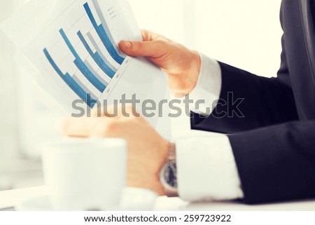 picture of businessman on meeting discussing graphics