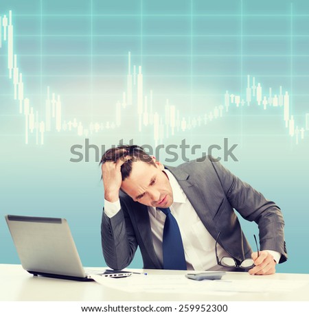 business, office and money concept - stressed businessman in black eyelgasses with laptop computer, papers, calculator and forex chart