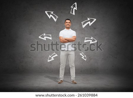 choice, direction, possibilities and people concept - smiling man in white t-shirt with crossed arms over arrow doodles and concrete background
