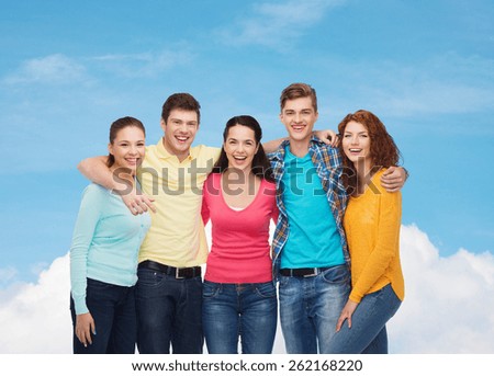friendship, dream, future and people concept - group of smiling teenagers over blue sky with white cloud background