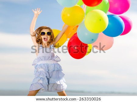 summer holidays, celebration, children and people concept - happy jumping girl with colorful balloons outdoors