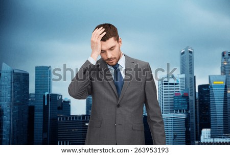 business, fail and crisis concept - young businessman having headache over city background