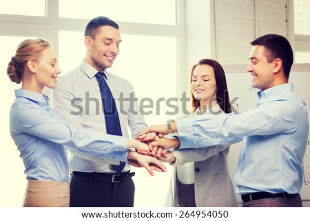success, business, office and winning concept - happy business team celebrating victory in office