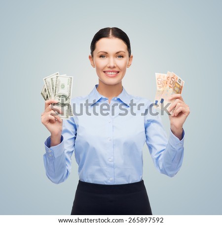 business, people, lottery, banking and finances concept - young businesswoman with dollar and euro cash money over blue background