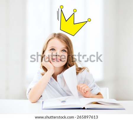 people, children, imagination and fairy tales concept - smiling girl reading book at home with castle and crown doodle over head