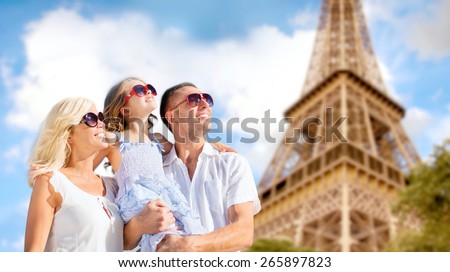 summer holidays, travel, tourism and people concept - happy family in paris over eiffel tower background