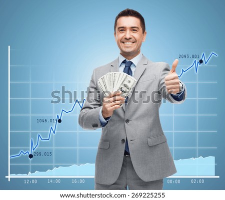 business, people and finances concept - smiling businessman with european money showing thumbs up over growing chart and blue background