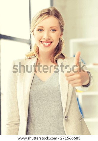 bright picture of young woman with thumbs up