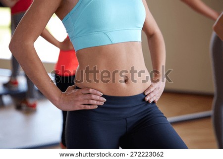 fitness, sport, training, people and lifestyle concept - close up of women working out in gym