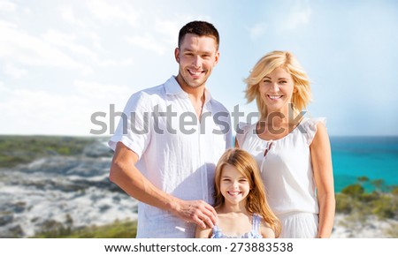 holidays, travel, tourism and people concept - happy family over summer beach background
