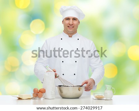 cooking, profession, haute cuisine, food and people concept - happy male chef cook baking over green lights background