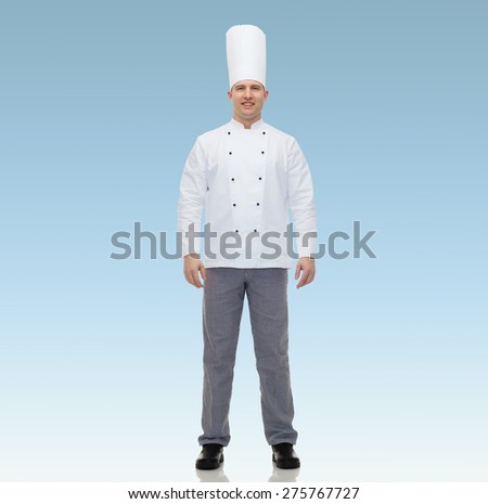 cooking, profession and people concept - happy male chef cook over blue background