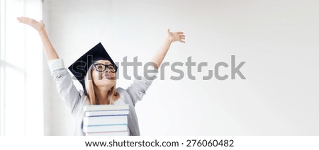 education concept - picture of happy student in graduation cap with stack of books