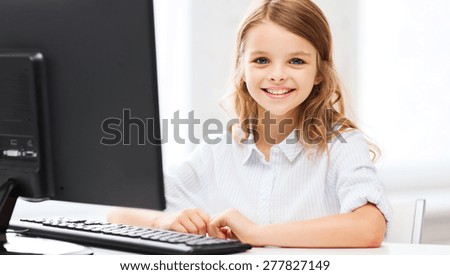 education, school, technology and internet concept - little student girl with computer at school