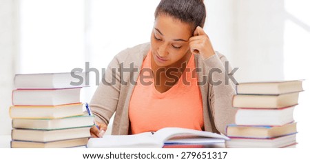 education and business concept - international student studying in college
