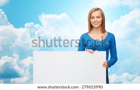 people, advertisement and sale concept - smiling young woman with blank white board over blue sky and clouds background