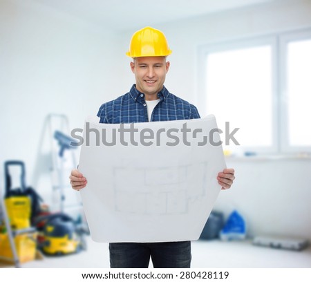 repair, construction, building, people and maintenance concept - smiling male builder or manual worker in helmet reading blueprint over room with work equipment background