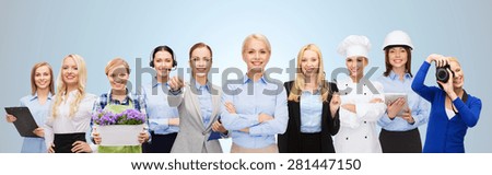 people, profession, qualification, employment and success concept - happy businesswoman with group of professional workers over blue background