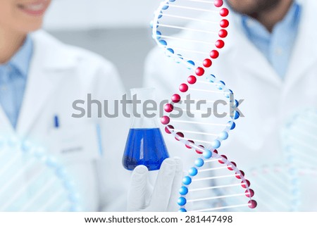 science, chemistry, biology, medicine and people concept - close up of scientists with test tube or glass flask making test or research in clinical laboratory