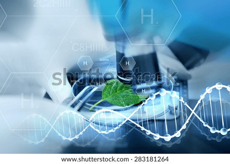 science, chemistry, biology and people concept - close up of scientist hand with microscope and green leaf making research in laboratory over hydrogen chemical formula and dna molecule structure