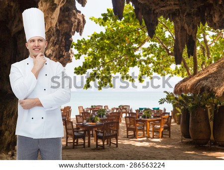 cooking, profession, inspiration and people concept - happy male chef cook thinking over restaurant lounge on beach