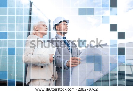 business, partnership, architecture and people concept - businessman and businesswoman with blueprint and helmets over city street and blue grid background