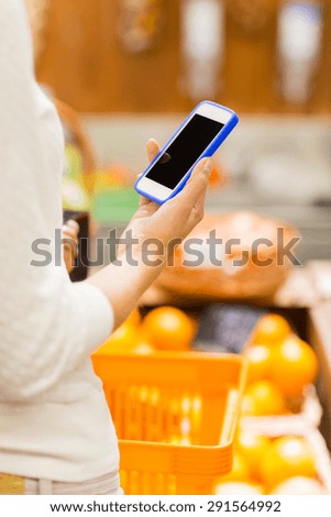 sale, shopping, consumerism and people concept - close up of young woman with food basket in market