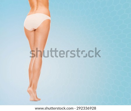 Foto de Beauty concept. Portrait of fit girl in underwear looking at camera  with joy. She is wearing high waist panties and comfortable bra. Isolated  on background do Stock