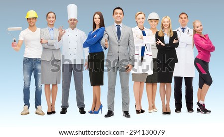 people, profession, qualification, employment and success concept - happy businessman with group of professional workers showing thumbs up over blue background