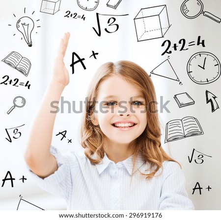 education and school concept - little student girl studying and raising hand at school