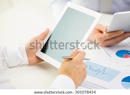 business, people, technology, advertisement and teamwork concept - close up of businessman hands with tablet pc computer blank screen at office