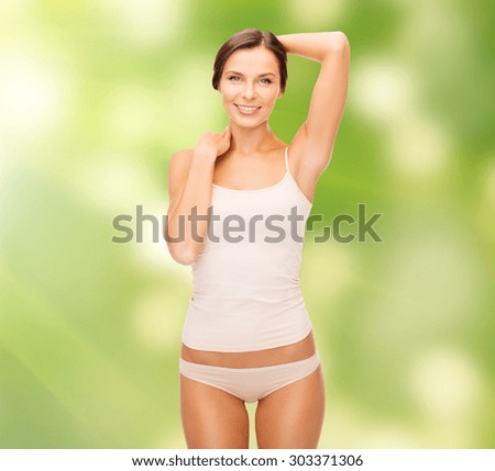 health and beauty, eco, bio, nature concept - beautiful woman in beige cotton underwear