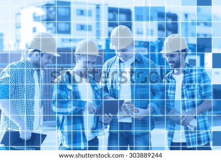 business, building, teamwork, technology and people concept - group of smiling builders in hardhats with tablet pc computer and clipboard outdoors over blue squared grid background