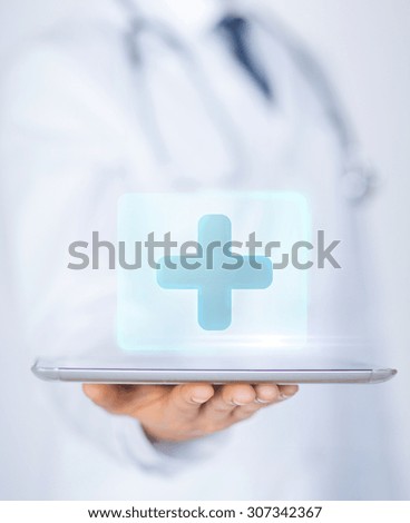 close up of male doctor holding tablet pc with medical app